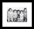 Children Sitting on Sofa - Framed Print