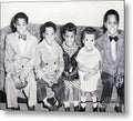 Children Sitting on Sofa - Metal Print